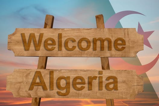 welcome to algeria sing on wood background with blending national flag