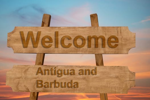 welcome to antigua and barbuda sing on wood background