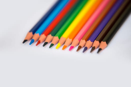 colorful pencils isolated on a white paper background,selective focus