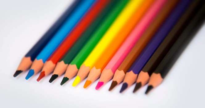 colorful pencils isolated on a white paper background,selective focus
