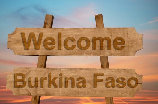 welcome to burkina faso sing on wood background