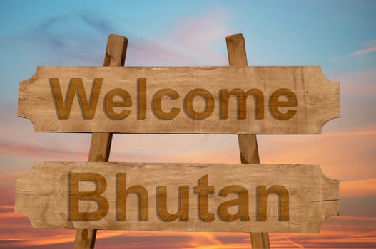 welcome to bhutan sing on wood background