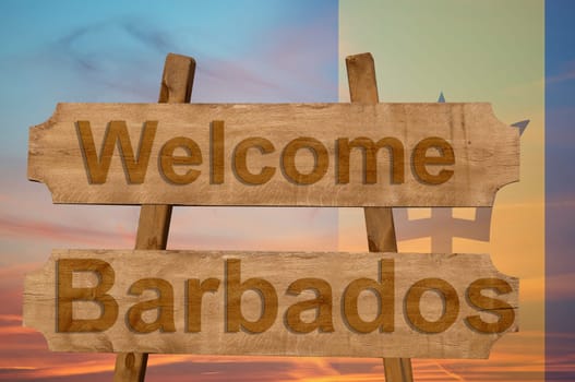 welcome to barbados sing on wood background with blending national flag