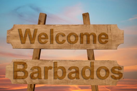 welcome to barbados sing on wood background