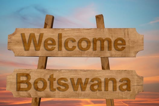 welcome to botswana sing on wood background