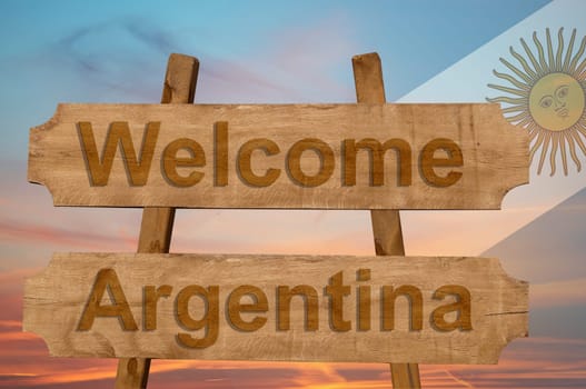 welcome to argentina sing on wood background with blending national flag