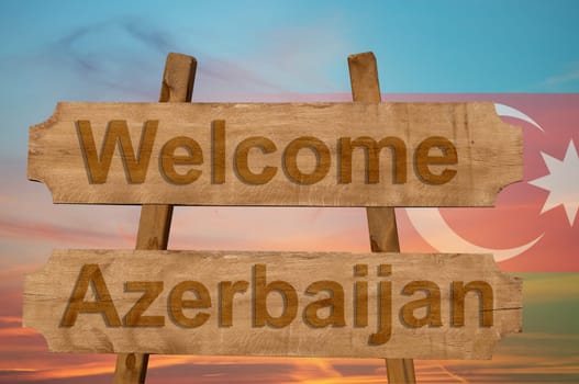 welcome to azerbaijan sing on wood background with blending national flag