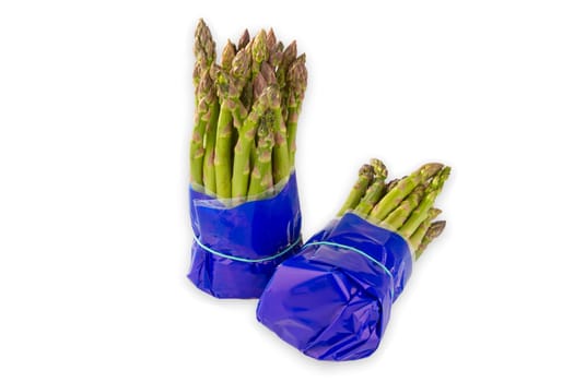 Fresh green asparagus exposed on a white background