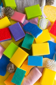 Colorful household sponges in detail as a background