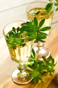 Maibowle with woodruff on a bright background