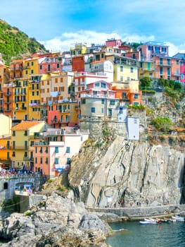 Colorful traditional houses on a rock over Mediterranean sea t, Manarola, Cinque Terre, Italy