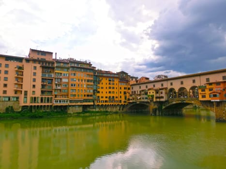 Ponte Vecchio bridge in Florence, Italy. Arno River. Tuscany. Rainy day