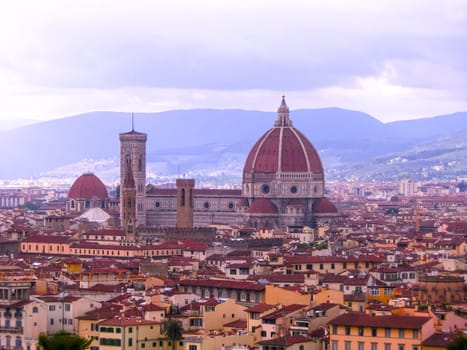 View of the Cathedral Santa Maria del Fiore in Florence, Italy - Florence's cathedral stands tall over the city with its magnificent Renaissance dome designed by Filippo Brunelleschi.