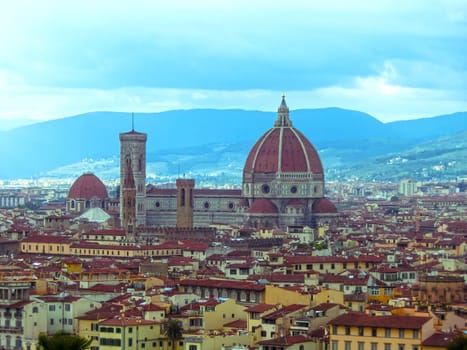 View of the Cathedral Santa Maria del Fiore in Florence, Italy - Florence's cathedral stands tall over the city with its magnificent Renaissance dome designed by Filippo Brunelleschi.