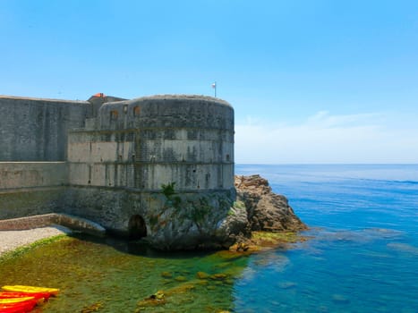Dubrovnik, Croatia - June 07, 2015: View on the fortress and marina in the old town of Dubrovnik, Croatia. Dubrovnik is a UNESCO World Heritage site