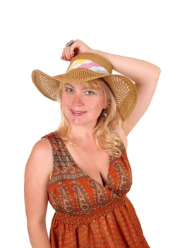A portrait image of a pretty blond woman in a dress wearing a straw.hat, isolated for white background..