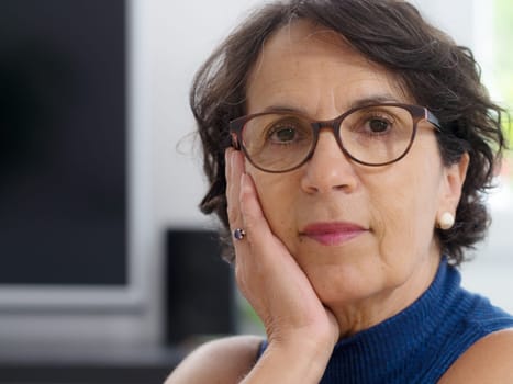 a portrait of a mature woman with glasses