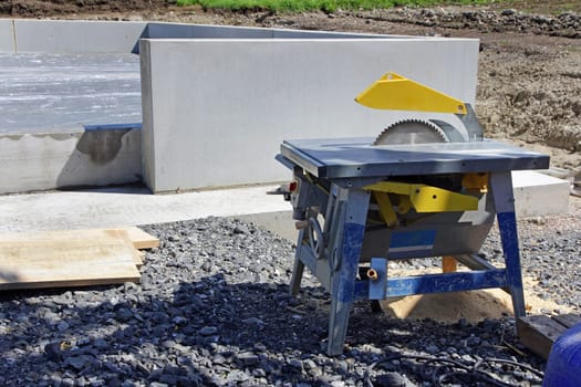 Circular table saw with saw blade at a construction site