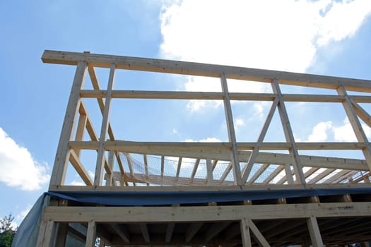 The new construction of a wooden house. Shell of a wooden house