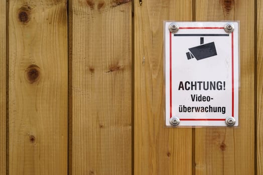 Sign with the inscription "Video surveillance"" at a construction site"