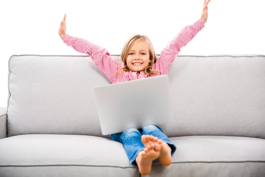 Cute little girl at home studying