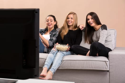 Girls watching 3D movies with popcorn