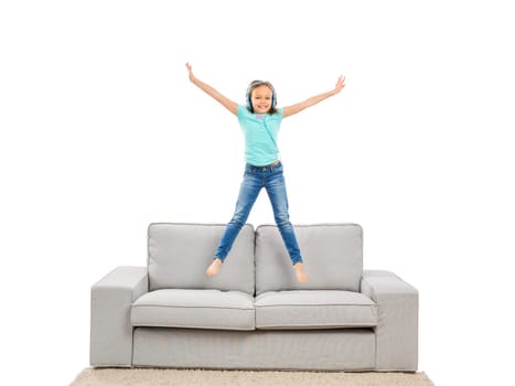 Cute blonde girl jumping and listen music