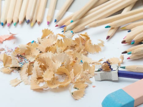 the colored pencils, eraser and pencil sharpener