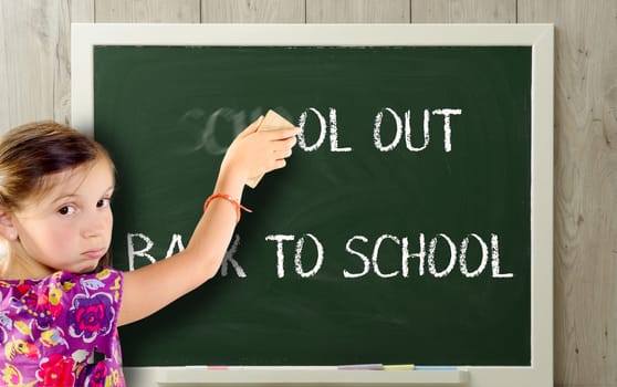 a girl clears school out on greenblackboard
