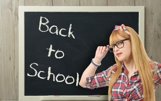 back to school, a pretty teacher with black glasses