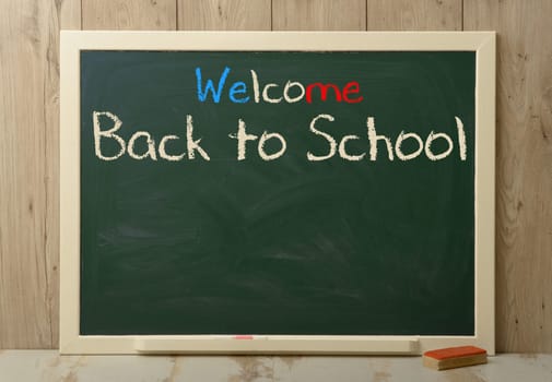 back to school written on agreen blackboard