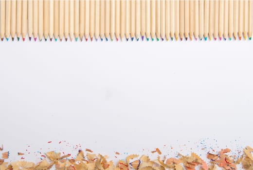 Colorful pencil crayons on a white paper