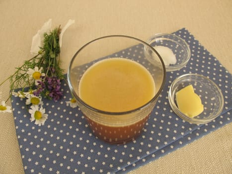 Butter coffee in a glass with butter and coconut oil
