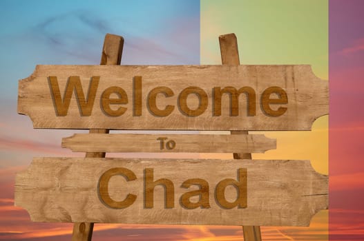 welcome to chad sing on wood background with blending national flag