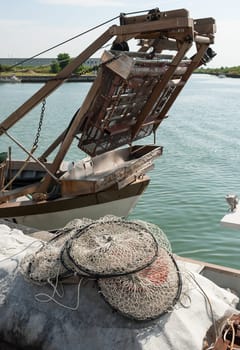 Pot made of nylon net with more rooms suitable for fishing in the lagoon to dry on the pier.