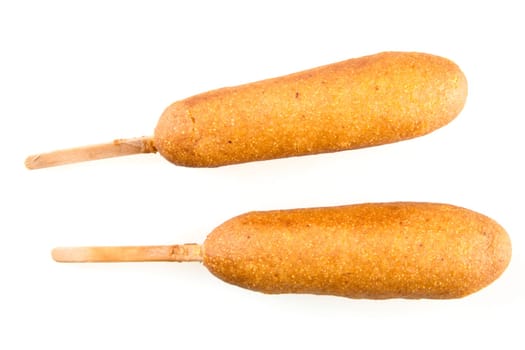 Two corn dogs isolated on white background.