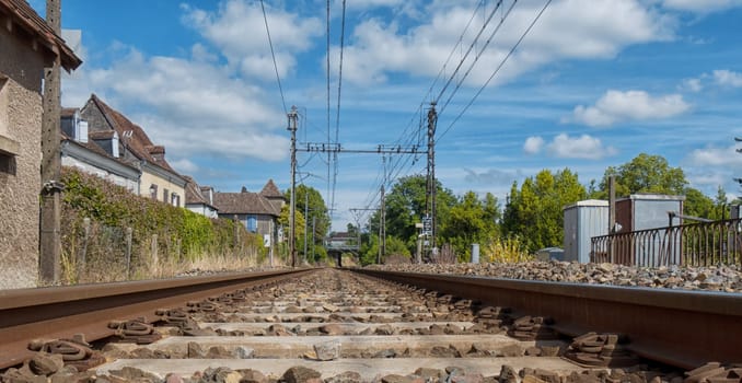 Railway track with Orthez village in France