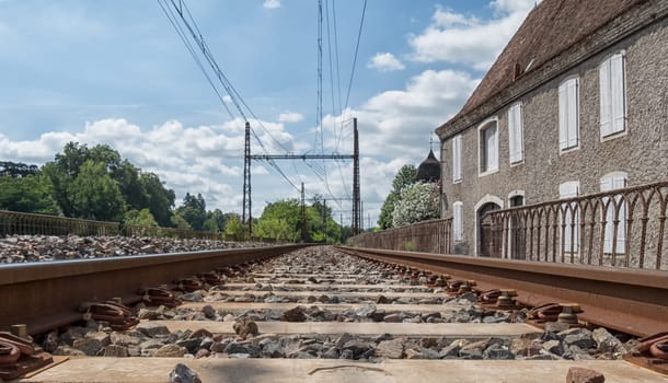 Railway track with Orthez village in France