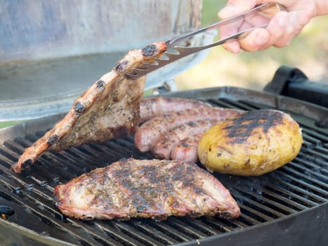 different grilled meat on the barbecue
