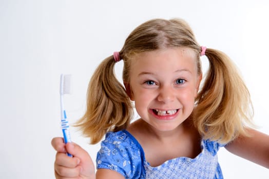 little funny girl with space width and toothbrush