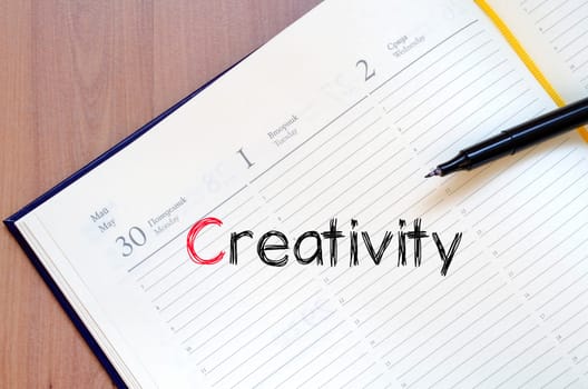Creativity text concept write on notebook