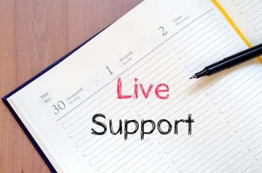 Live support text concept write on notebook