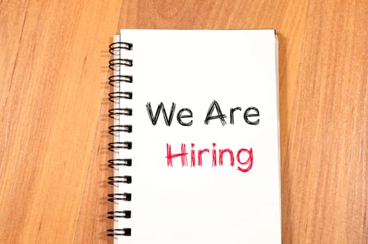 We are hiring news text concept write on notebook