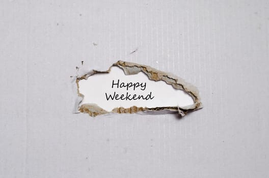 The words happy weekend appearing behind torn paper