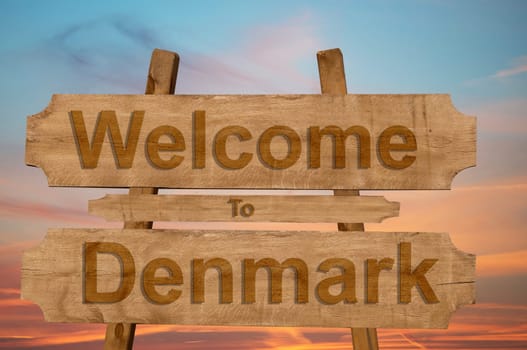 welcome to denmark sing on wood background