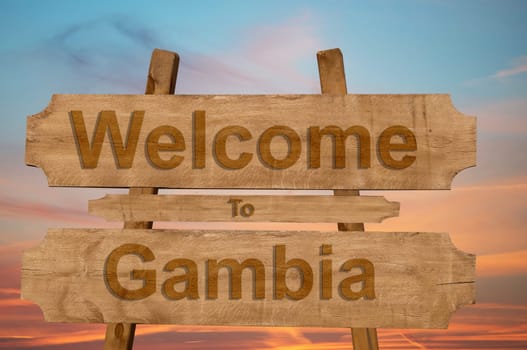 welcome to the gambia sing on wood background