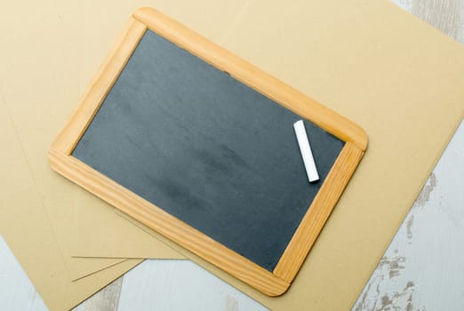 chalkboard and chalk on a wooden table