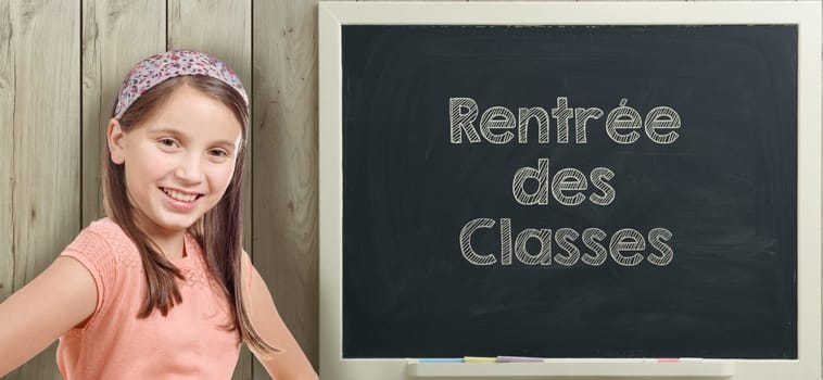 "rentree des classes"" written on  blackboard with pretty young girl"