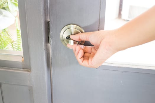 Hand holding the door locker, stock photo