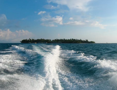 Over water bungalows and the blue sea and sky